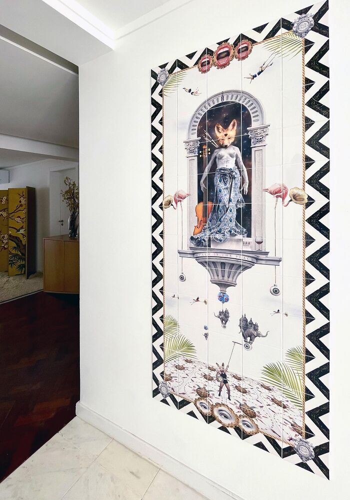 Hallway wall tile works depicting fox-headed figure and black-and-white zigzag border
