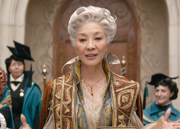 Michelle Yeoh in a golden-embroidered costume, in a debate on Hollywood's plastic surgery obsession
