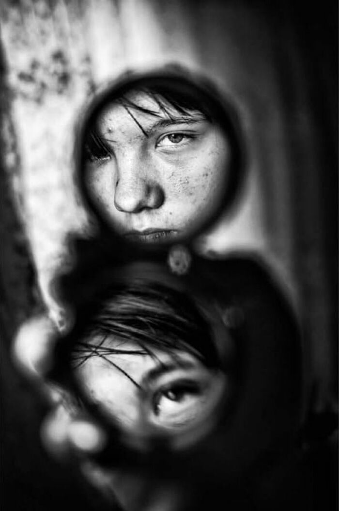 Murat Harmanlikli captures the intensity of childhood in this street photo of a child's face reflected in a mirror.