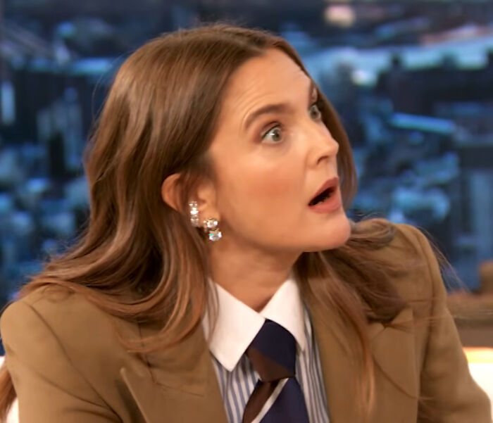 Drew Barrymore, wide-eyed, giving her brutal hot take on celebrities.
