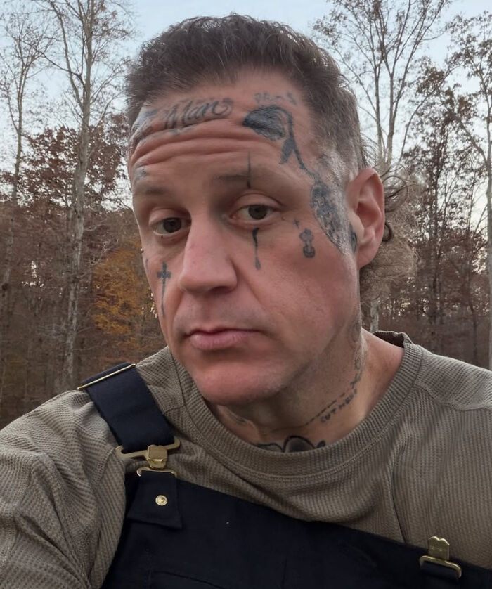 A man with numerous face tattoos and a serious expression in an outdoor setting, representing celebrity hot takes.