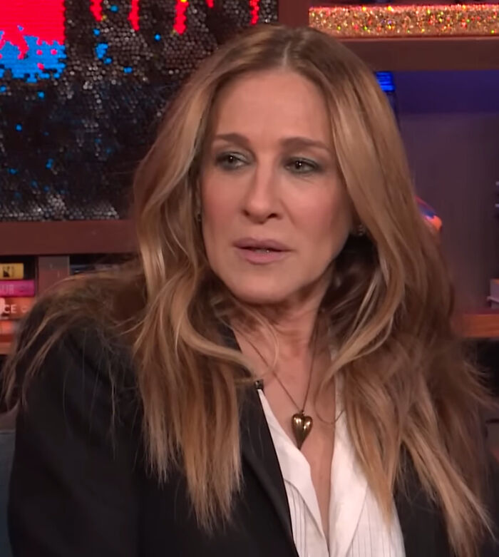Sarah Jessica Parker, a celebrity, listens intently, capturing the essence of brutal hot takes from people.