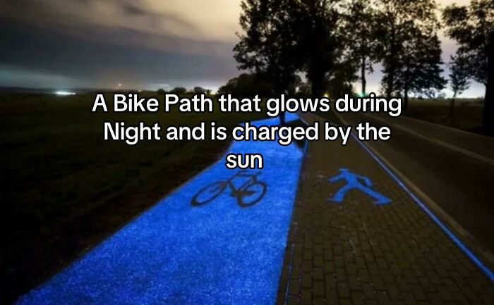 Bike path glowing at night charged by the sun with bike and pedestrian symbols