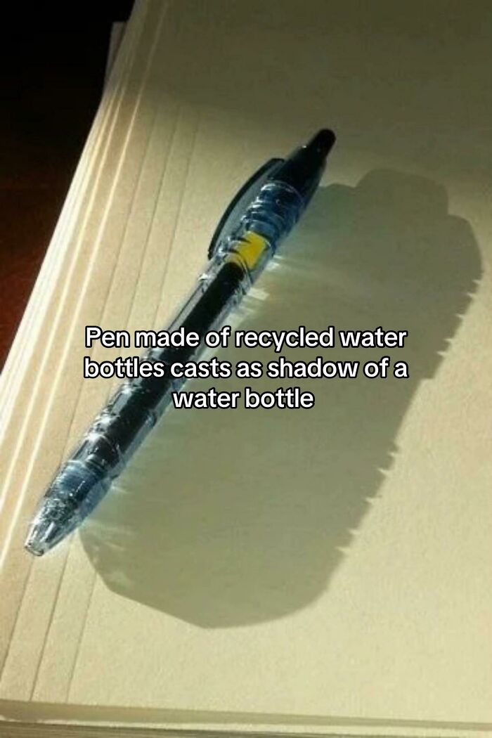 Pen made from recycled water bottles casting shadow of a water bottle