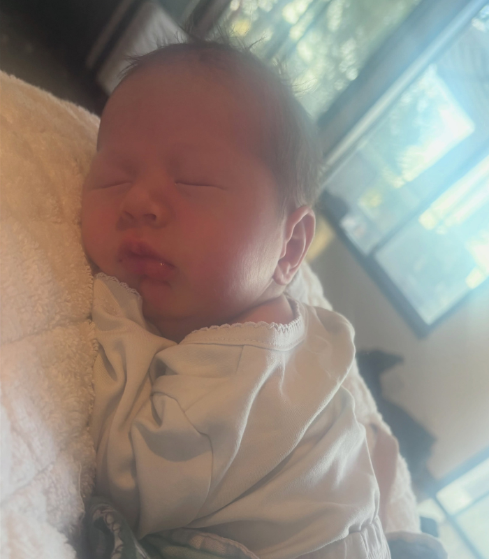 Close-up of the sleeping newborn, John Lennon's first grandson, with an unusual name. Close-up of the sleeping newborn, John Lennon's first grandson, with an unusual name.