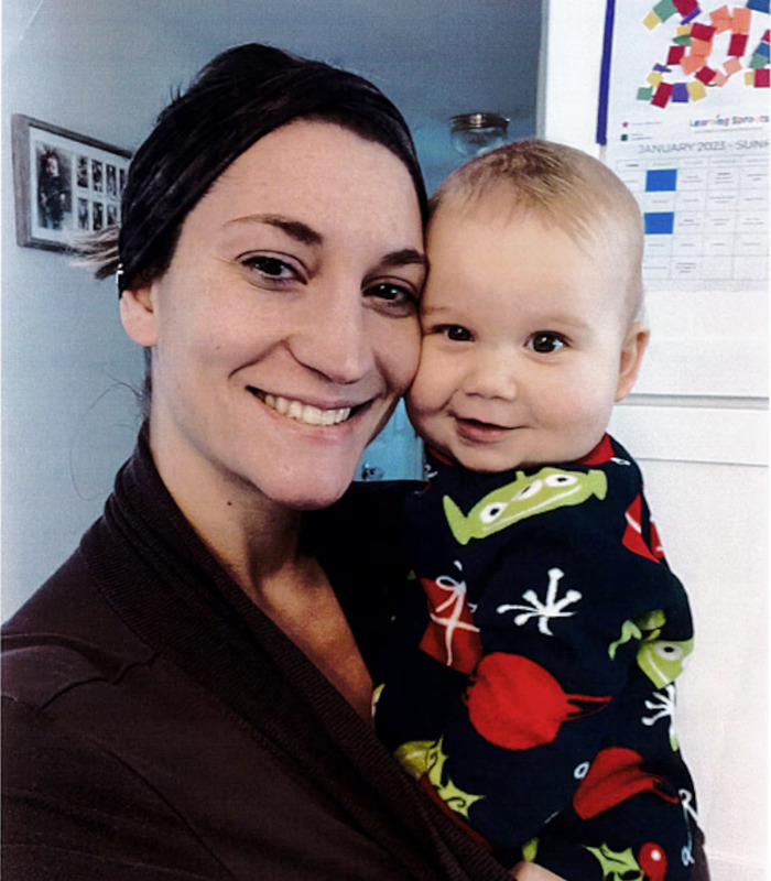 Lindsay Clancy smiling and holding a baby, prior to the trial that ended in a mistrial verdict. Lindsay Clancy smiling and holding a baby, prior to the trial that ended in a mistrial verdict.
