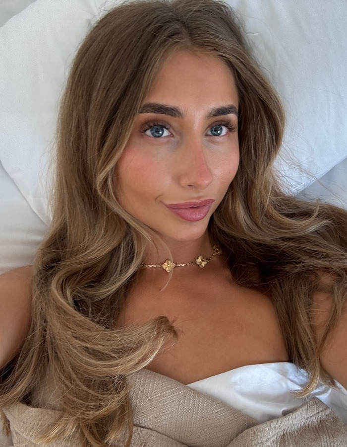 Lily Phillips in bed, looking at the camera, highlighting a detail viewers are fixated on. Lily Phillips in bed, looking at the camera, highlighting a detail viewers are fixated on.