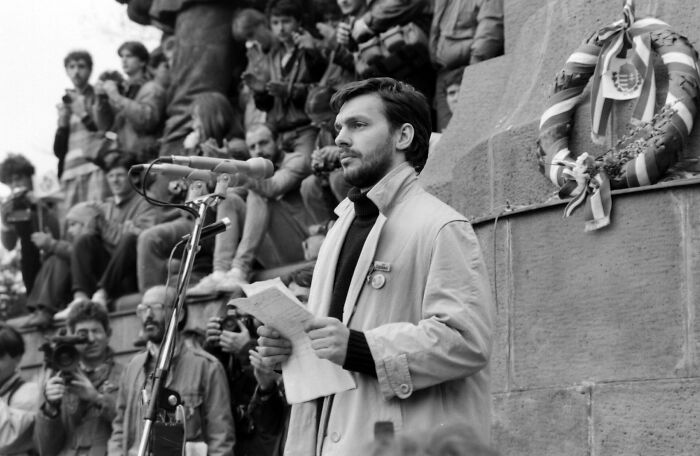 Young Viktor Orbán, a public figure, giving a speech, an example of destroying a legacy.