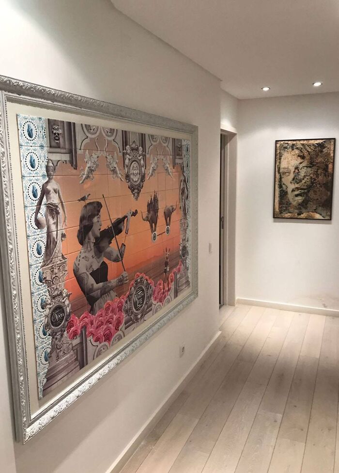 Framed tile works mural of violinist and roses in modern hallway