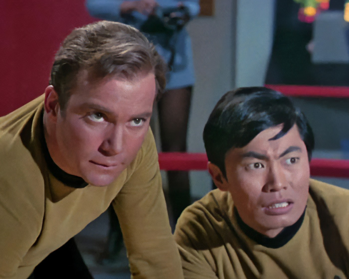 Hollywood bromance between William Shatner and George Takei on set.