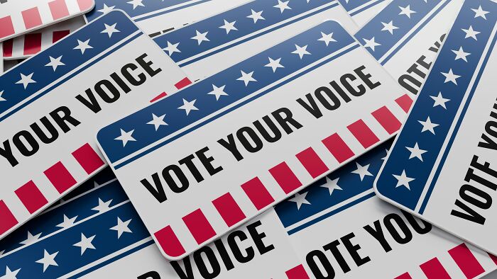 Close-up of presidential vote campaign stickers, depicting an era of political scandals.