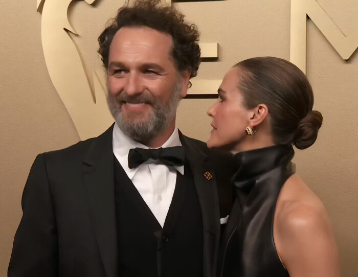Emmy Winner and his wife sharing a tense moment at an event, body language expert notes.
