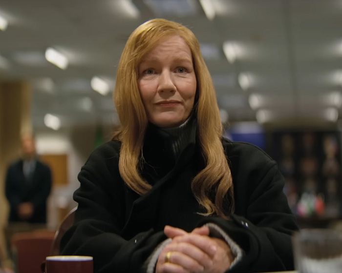 Actress snobbish red carpet response ignites Hollywood debate. A woman with long reddish-blonde hair sits looking forward. Actress snobbish red carpet response ignites Hollywood debate. A woman with long reddish-blonde hair sits looking forward.