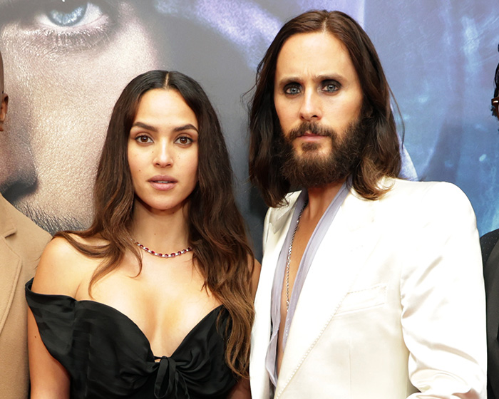 Actress Adria Arjona and Jared Leto at an event, highlighting method acting and co-star behavior. Actress Adria Arjona and Jared Leto at an event, highlighting method acting and co-star behavior.