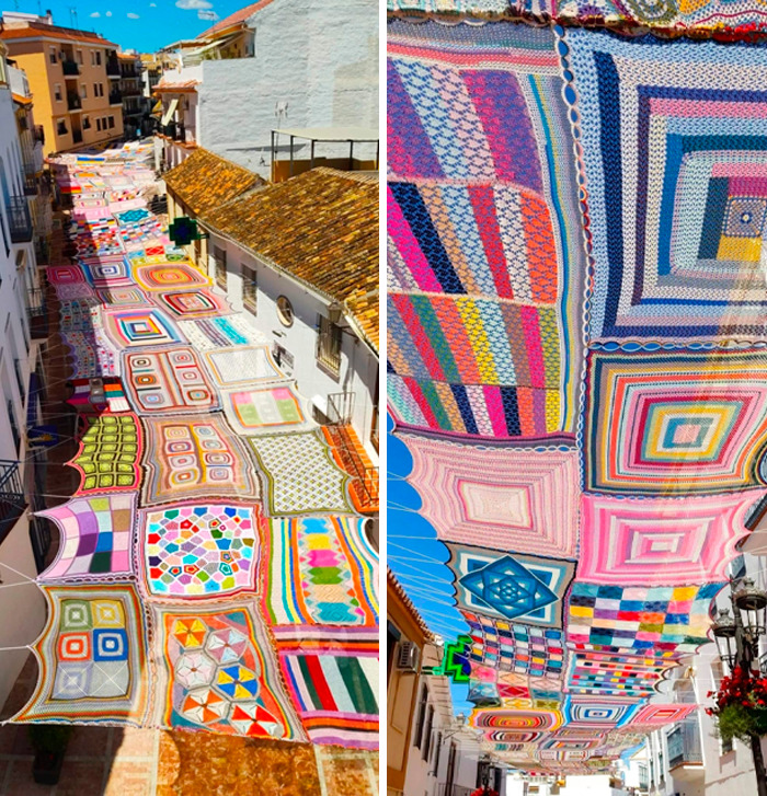A vibrant street covered with colorful, knitted squares providing a much-needed break from the ordinary.