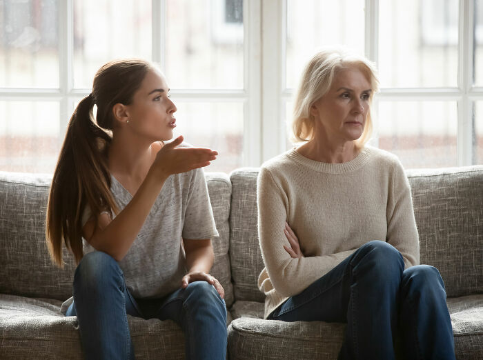 Young woman arguing with older woman showing tension in family boundaries Young woman arguing with older woman showing tension in family boundaries