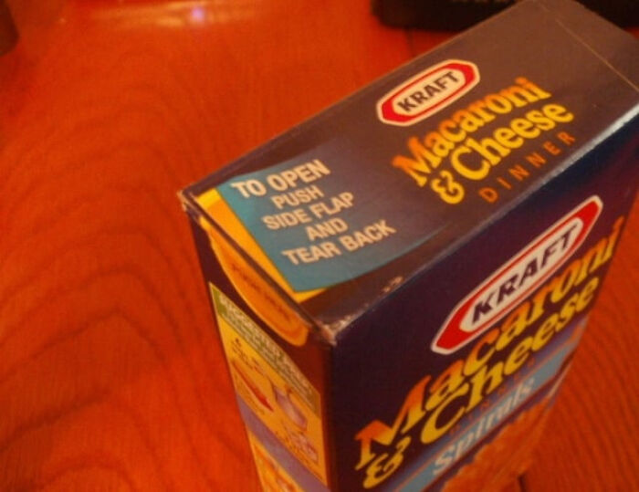 A box of Kraft Macaroni & Cheese with instructions, highlighting an everyday inconvenience.