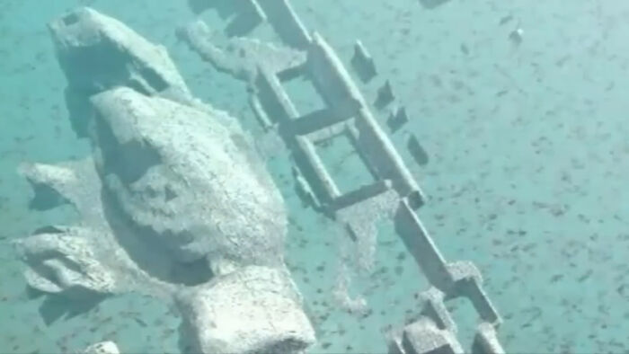 A submerged structure representing archaeological things discovered at the bottom of the ocean