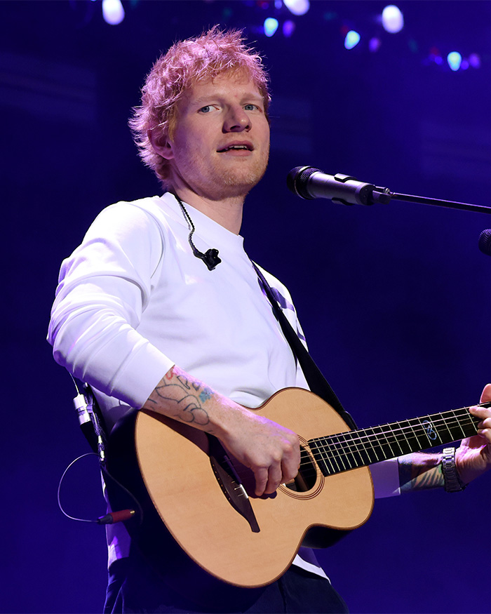 Ed Sheeran on stage with his guitar, Macklemore allegedly removed from his tour.