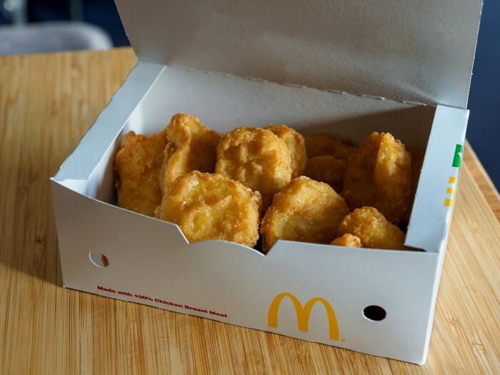 A box of McDonald's chicken nuggets sits on a wooden surface, showing how someone's life story could end unexpectedly.