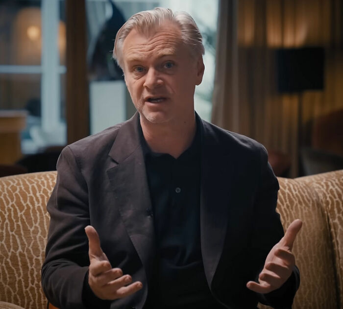 A man speaking, gesturing with his hands, discussing Hollywood's bleak reality after The Odyssey's success. A man speaking, gesturing with his hands, discussing Hollywood's bleak reality after The Odyssey's success.