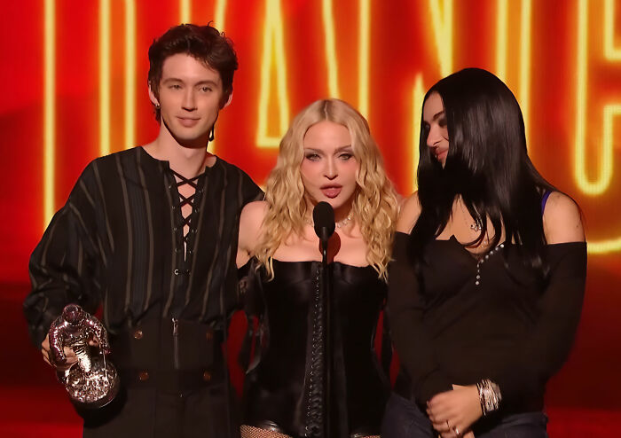 Madonna accepts award with two others at the VMAs stage Madonna accepts award with two others at the VMAs stage