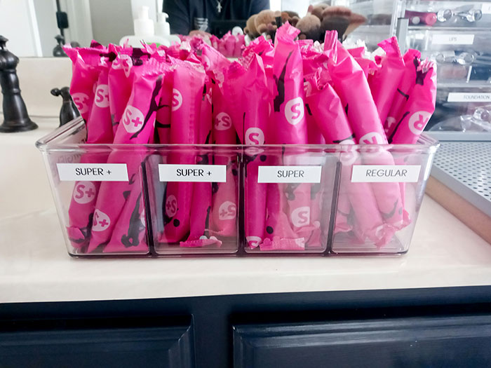 A clear organizer filled with various sizes of tampons, labeled Super+, Super, and Regular, ready for petty revenge. A clear organizer filled with various sizes of tampons, labeled Super+, Super, and Regular, ready for petty revenge.