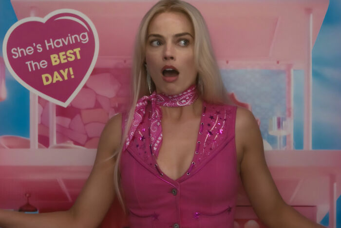 Margot Robbie surprised wearing pink outfit with best day sign Margot Robbie surprised wearing pink outfit with best day sign