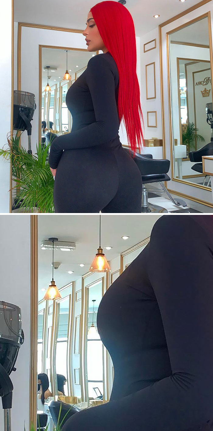 A woman with red hair and a black outfit, revealing a Photoshop fail with a distorted reflection.