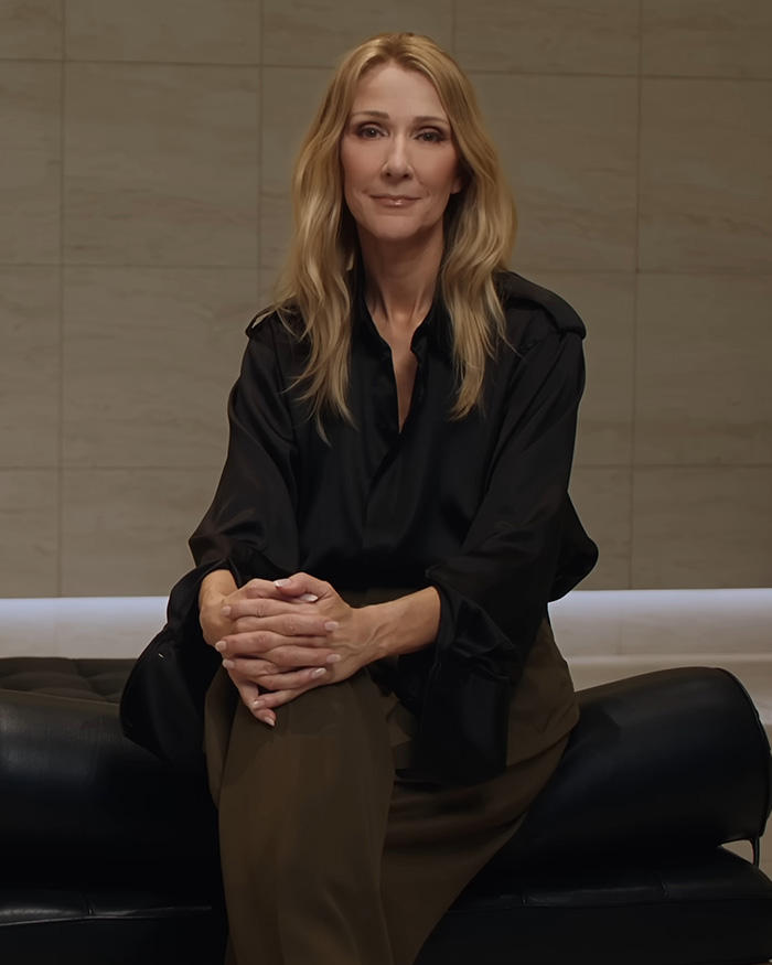 Celine Dion sitting with hands clasped, highlighting Celine Dion comeback amid stiff person syndrome Celine Dion sitting with hands clasped, highlighting Celine Dion comeback amid stiff person syndrome
