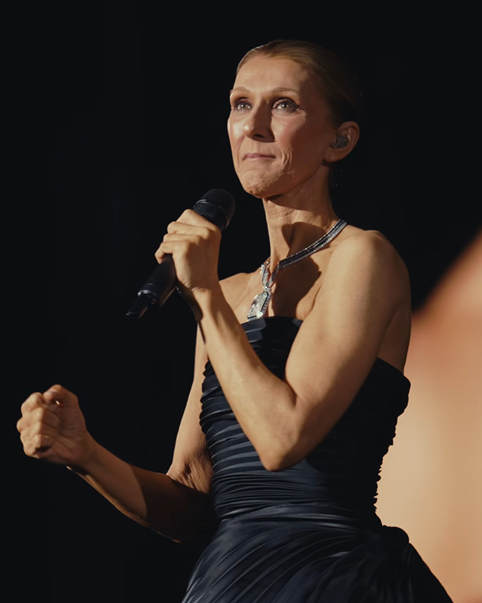 Celine Dion performing on stage, emphasizing Celine Dion comeback amid stiff person syndrome Celine Dion performing on stage, emphasizing Celine Dion comeback amid stiff person syndrome