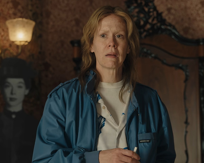 Sarah Paulson as a disturbing criminal looking shocked in a blue jacket Sarah Paulson as a disturbing criminal looking shocked in a blue jacket