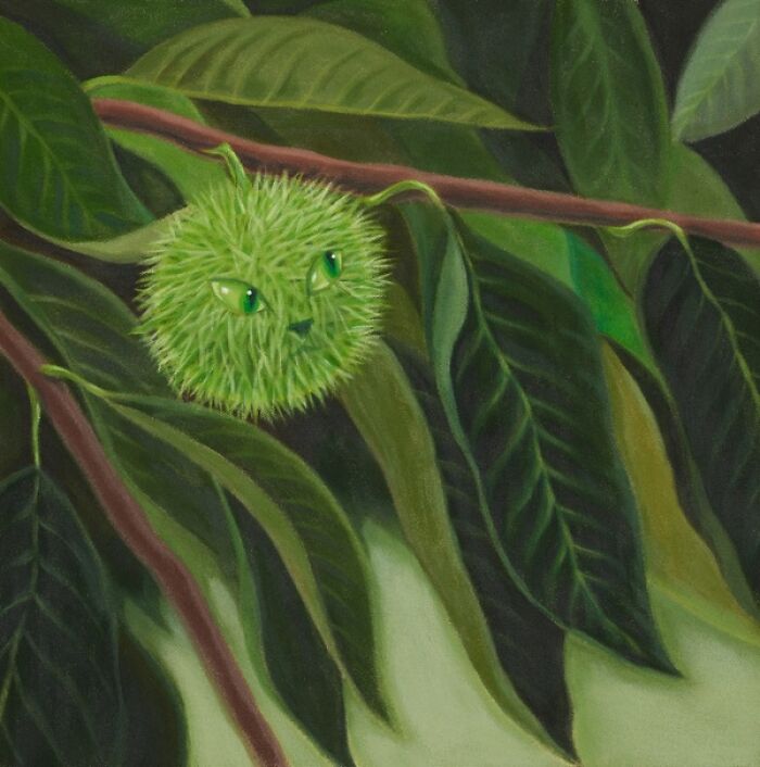 A surreal moment captured by a green, spiky creature with cat-like eyes nestled among green leaves on a branch.