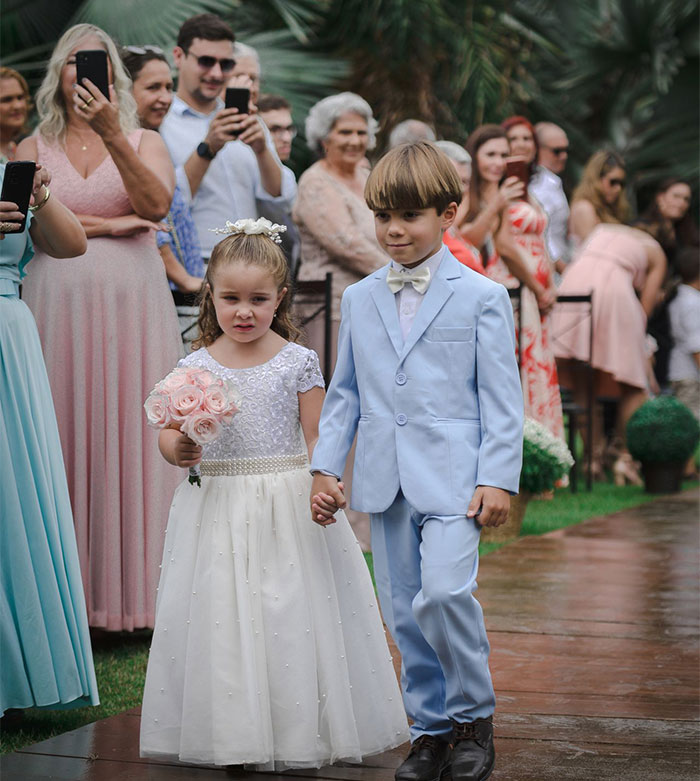 Children in wedding attire, contrasting with a child-free celebration and in-laws demanding exceptions.