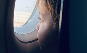 Woman Pays For Window Seat On Airplane, Baffled When She Finds A Kid Already In It