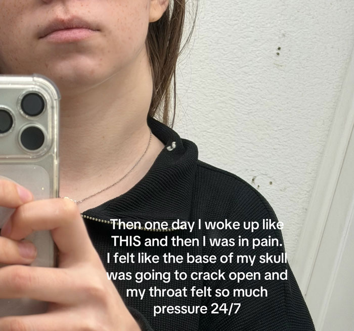 A woman taking a mirror selfie showing her neck, with an overlay text about waking up in pain and pressure in her throat, related to rare cancer. A woman taking a mirror selfie showing her neck, with an overlay text about waking up in pain and pressure in her throat, related to rare cancer.