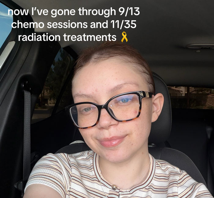 Smiling woman in glasses, undergoing rare cancer treatment, showing progress after altitude sickness misdiagnosis. Smiling woman in glasses, undergoing rare cancer treatment, showing progress after altitude sickness misdiagnosis.