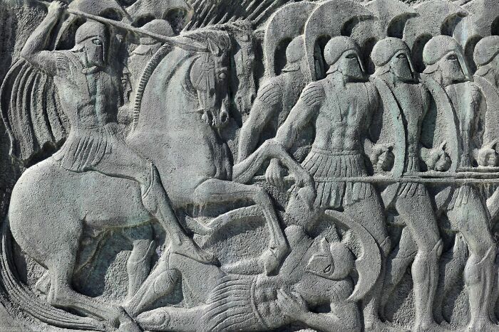 Historical facts relief depicting ancient Greek soldiers in battle, a common belief often made up.