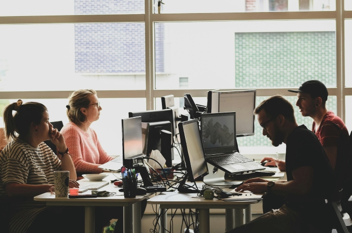 Employees working in an office, illustrating a situation where supervisors might try to make an employee look bad. Employees working in an office, illustrating a situation where supervisors might try to make an employee look bad.