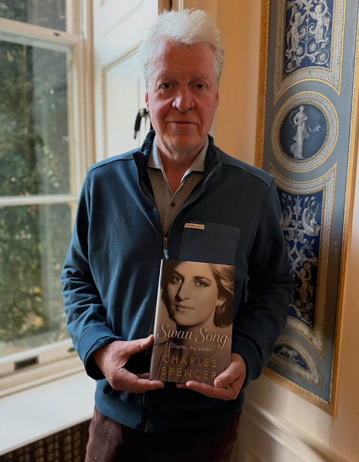 A man holding a book titled Swan Song: Diana, my sister by Charles Spencer, reflecting on concerns for Kate Middleton.