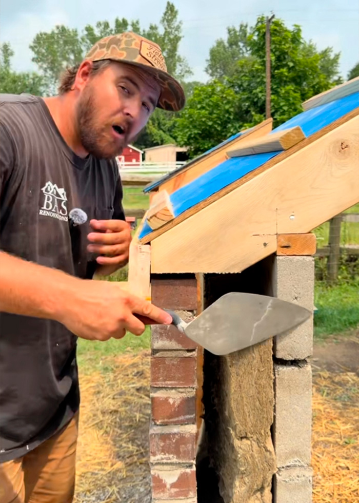 Construction expert pointing to different home building materials for the USA vs Europe debate. Construction expert pointing to different home building materials for the USA vs Europe debate.