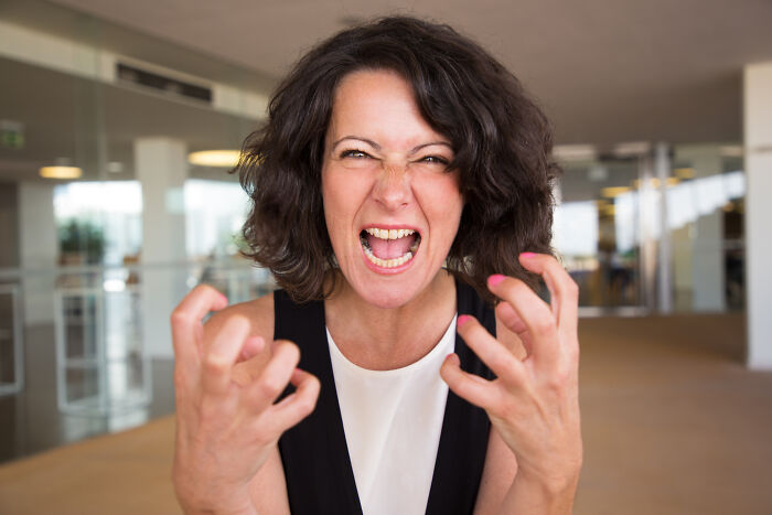 An angry woman expressing frustration and showing signs of marriage regrets