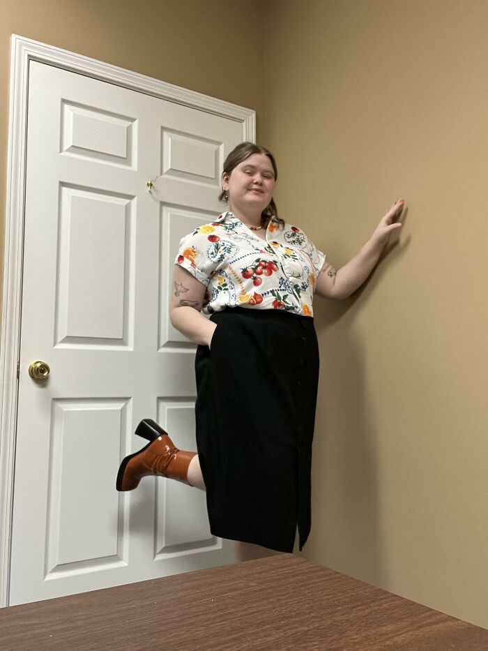 A woman stands on one leg looking like she is floating, making you look twice.