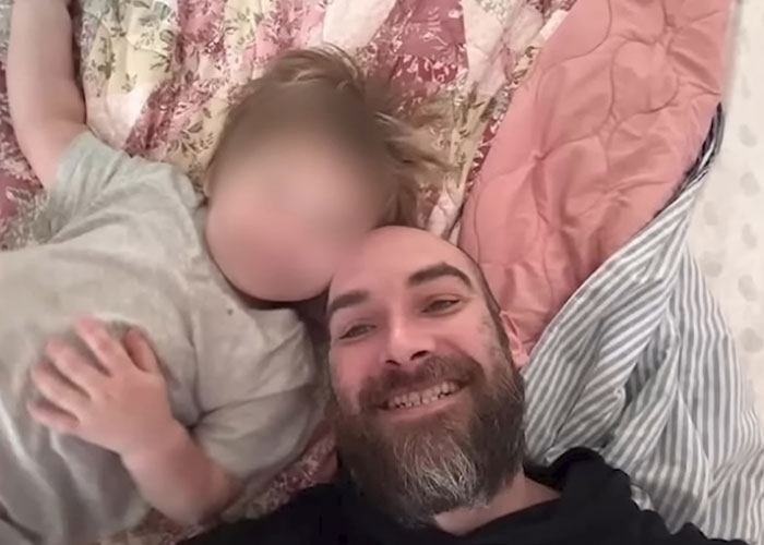 A man smiling, taking a selfie with a child, highlighting the children's mother as his attacker. A man smiling, taking a selfie with a child, highlighting the children's mother as his attacker.