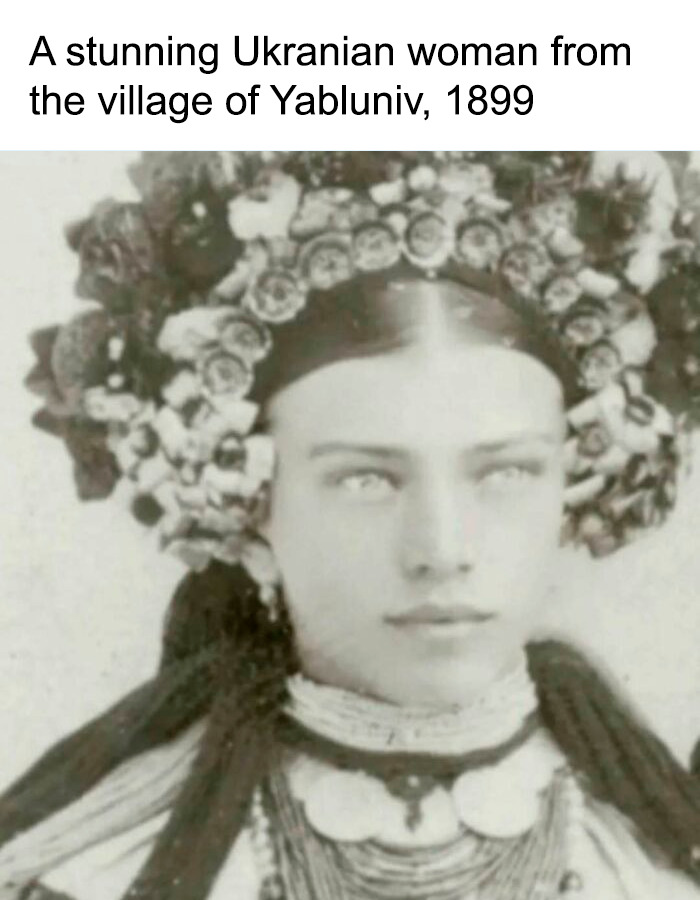 A black and white historical photo of a beautiful Ukrainian woman from Yabluniv wearing a traditional flower crown in 1899.