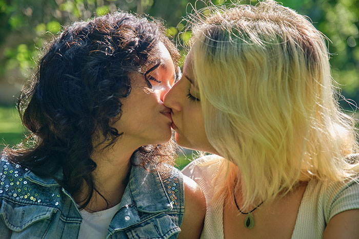 Two women kissing, symbolizing a wild delayed plot twist from life.