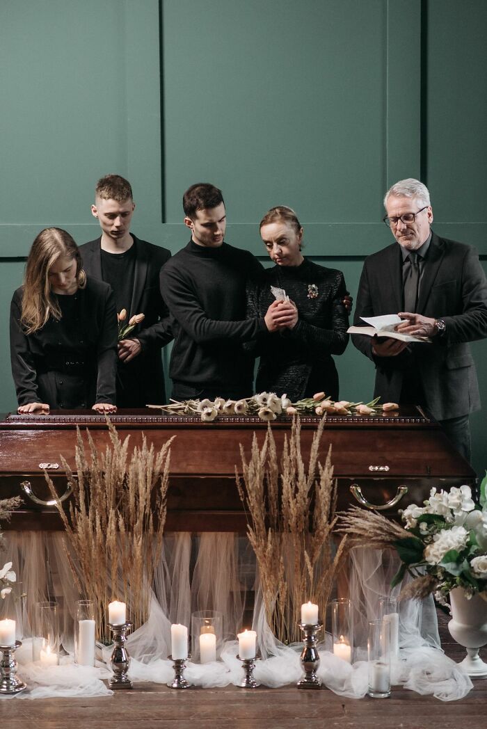 Family mourning at funeral with grieving expressions family cut off pain