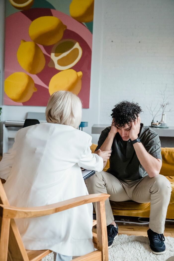 Therapist comforting young man symbolizing support during family cut off issues