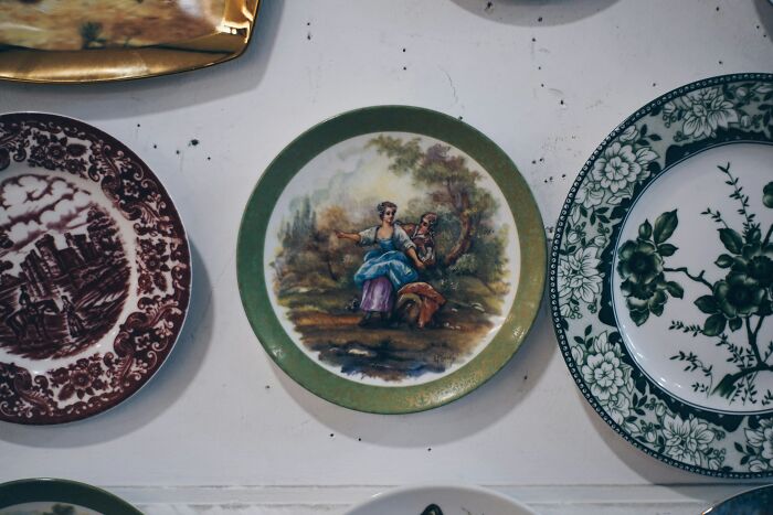 Decorative ceramic plates hanging on a wall, symbolizing disputes handled by divorce lawyers