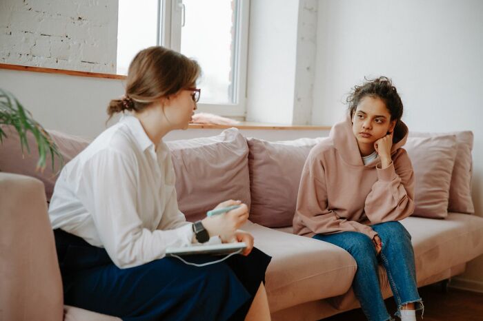 A therapist talks to a young woman, illustrating moments a marriage was over.